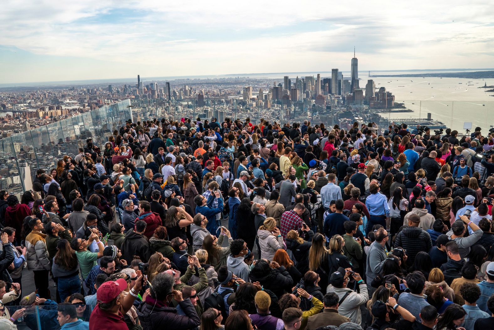 People watch the eclipse from the Edge observation deck at Hudson Yards in New York City.