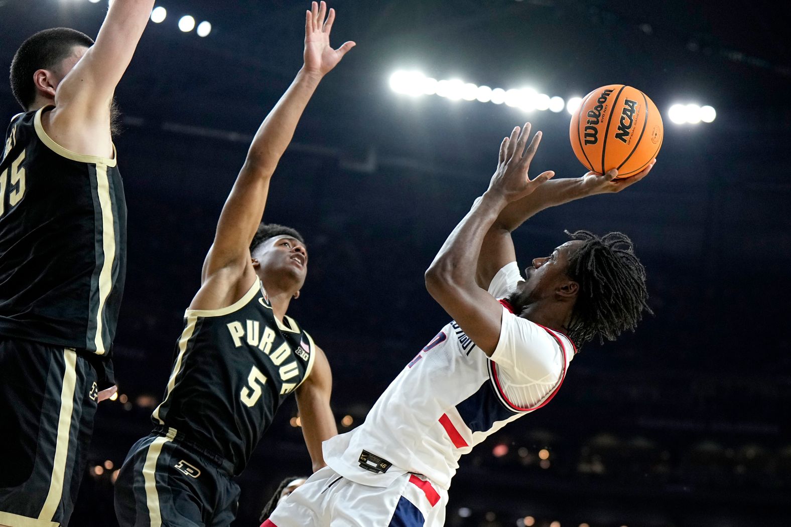 UConn's Tristen Newton takes a shot in the first half.