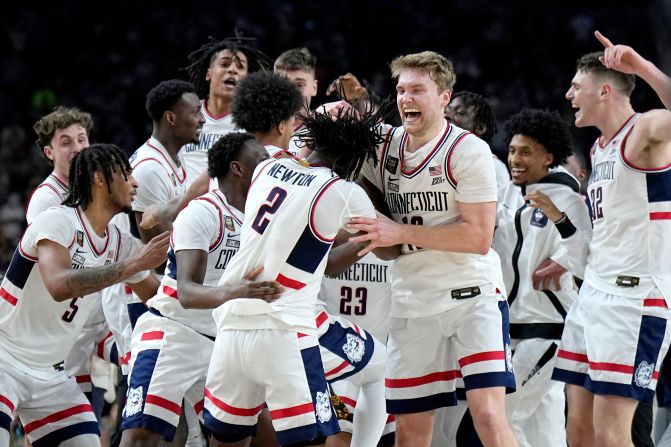 UConn players celebrate after defeating Purdue in the men's Final Four championship game in Glendale, Arizona, on Monday, April 8.