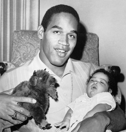 Simpson poses for a photo with his daughter Arnelle in 1969.