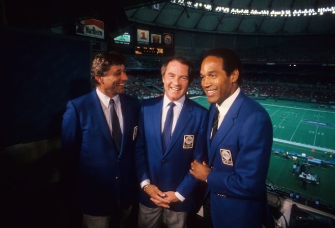 After his lauded career as a running back, Simpson became a sports broadcaster. Here he is seen in the booth with fellow ABC "Monday Night Football" announcers Joe Namath, left, and Frank Gifford in September 1985.