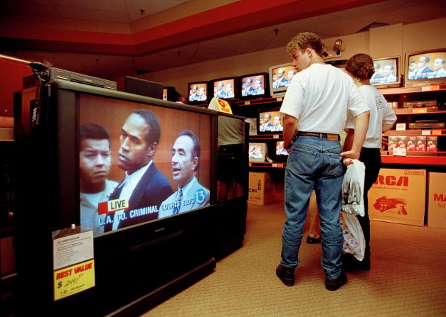 Simpson is shown on a TV in an electronics store in Tampa, Florida, while people shop on June 20, 1994.