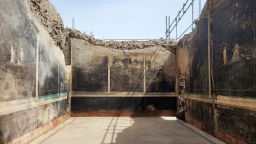 A view of a black-walled dining hall with 2,000-year old paintings inspired by the Trojan War is seen in this handout picture taken in the ancient archeological site of Pompeii and released on April 11, 2024. Parco Archeoligico di Pompei/Handout via REUTERS THIS IMAGE HAS BEEN SUPPLIED BY A THIRD PARTY. NO RESALES. NO ARCHIVES.