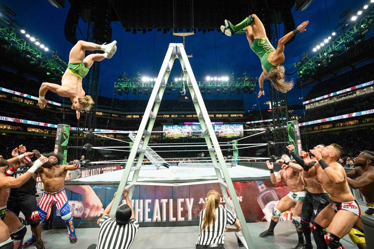 Tyler Bate and Pete Dunne fly off a ladder during a match at WWE WrestleMania 40 in Philadelphia on Saturday, April 6. 