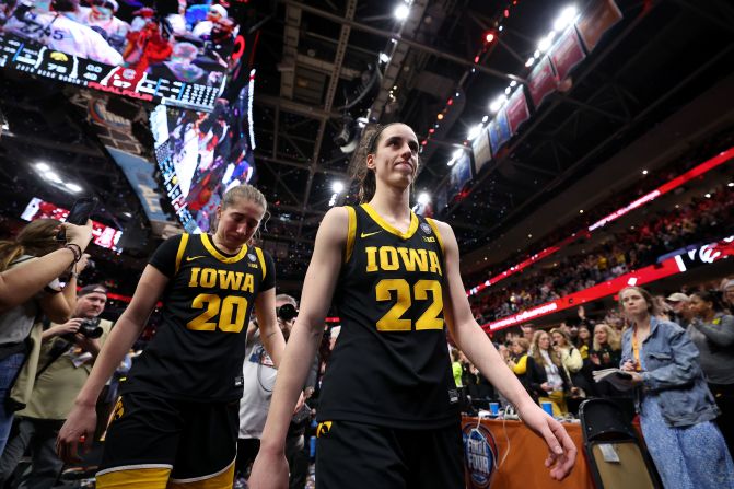 Iowa's Caitlin Clark, right, and Kate Martin walk off the court after losing to South Carolina in Cleveland on Sunday, April 7.