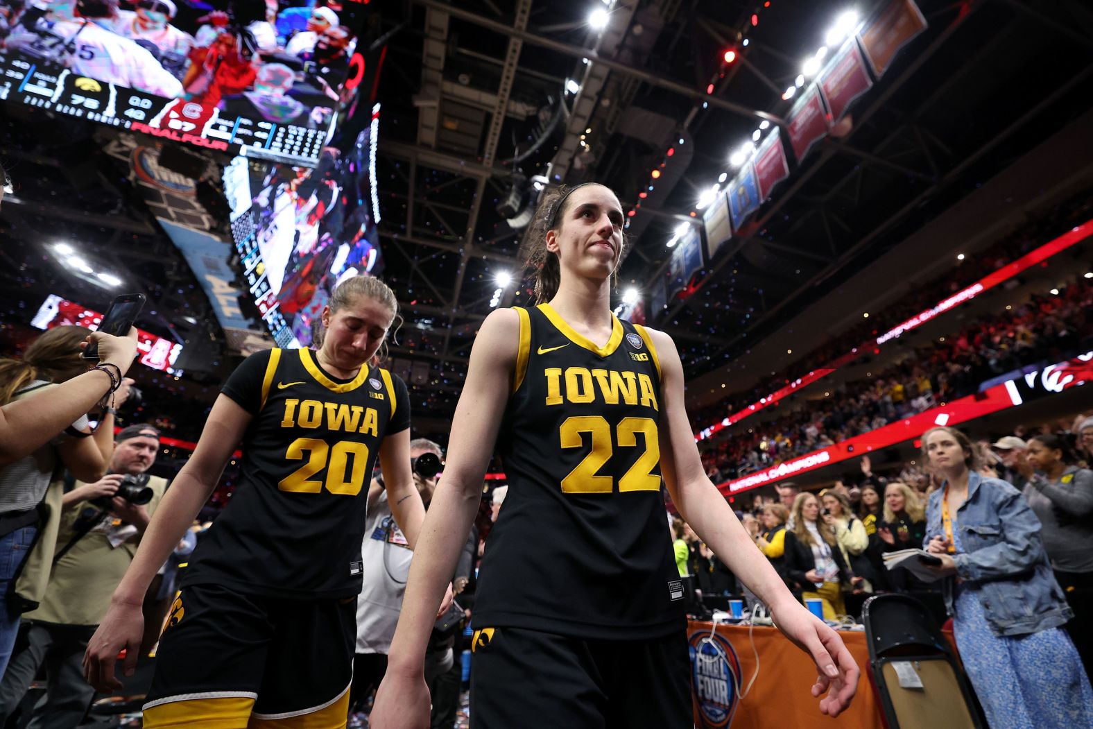 Iowa's Caitlin Clark, right, and Kate Martin walk off the court after losing to South Carolina in Cleveland on Sunday, April 7.