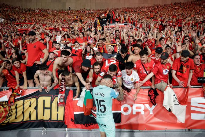 Fans comfort Real Mallorca defender Pablo Maffeo at the end of the Spanish Copa del Rey final football match between Athletic Club Bilbao and Real Mallorca in Seville, Spain, on Saturday, April 6. 