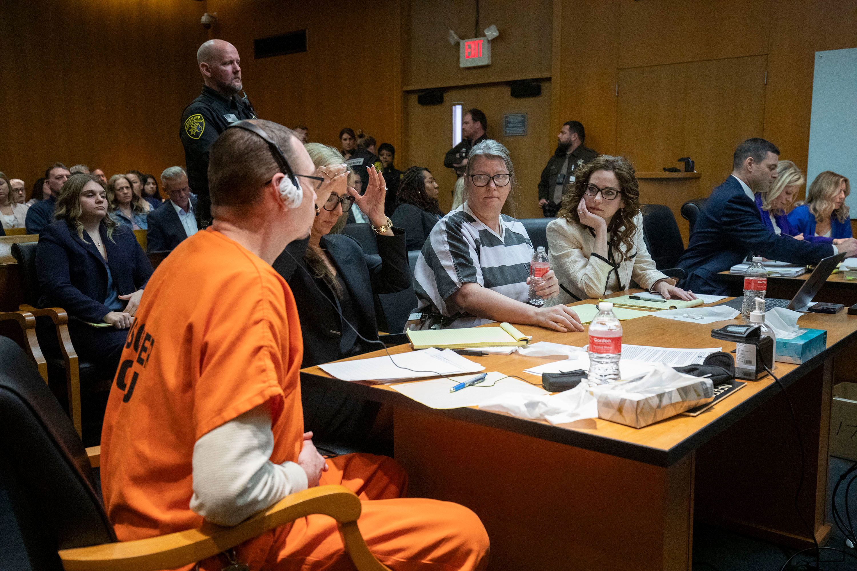 James Crumbley, his attorney Mariell Lehman, Jennifer Crumbley and her attorney Shannon Smith, sit in court for sentencing in Pontiac, Michigan, on Tuesday, April 9.