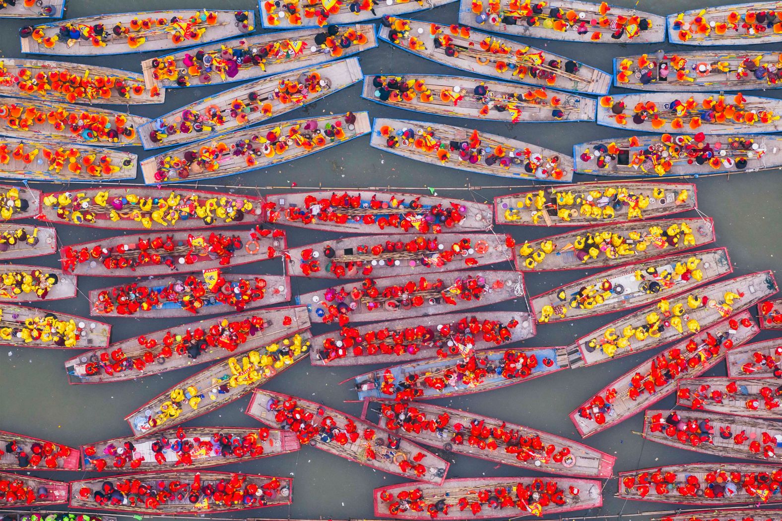 People participate in the Taizhou Jiangyan Qintong Boat Festival at the Qinhu National Wetland Park in Taizhou, in eastern China's Jiangsu province, on Saturday, April 6.