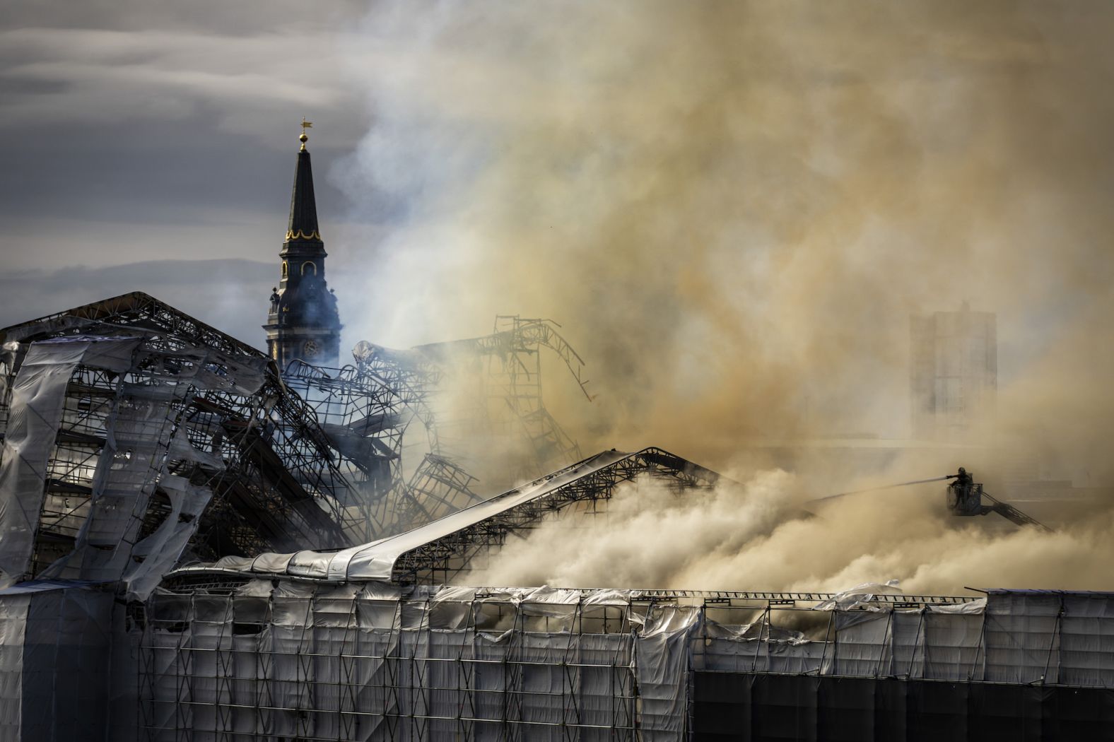 Firefighters battle a <a href="index.php?page=&url=https%3A%2F%2Fwww.cnn.com%2F2024%2F04%2F16%2Fstyle%2Fcopenhagen-old-stock-exchange-fire-intl%2Findex.html" target="_blank">blaze at Copenhagen's old stock exchange</a>, one of the Danish capital's most famous landmarks, on Tuesday, April 16. The building dates back to 1625. Copenhagen police launched an investigation on Wednesday, which they said would be a "complicated process."