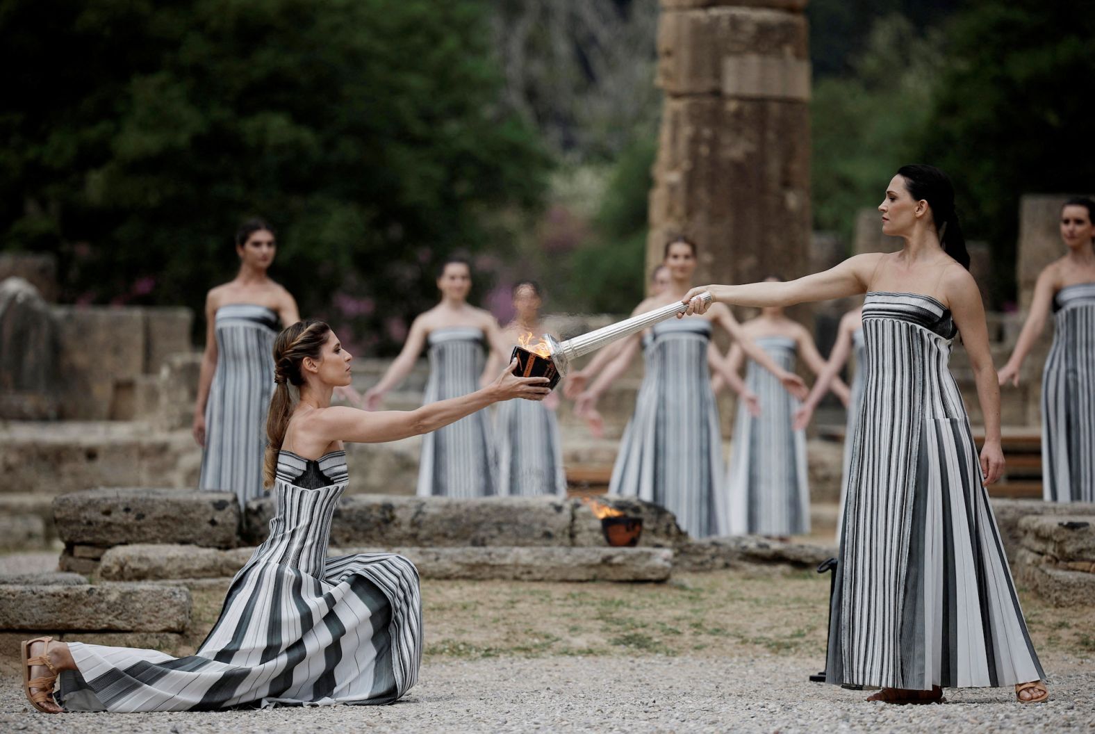 Greek actress Mary Mina, playing the role of High Priestess, carries the torch during the <a href="https://www.cnn.com/2024/04/16/sport/paris-2024-olympic-flame-lit-spt-intl/index.html" target="_blank">Olympic flame lighting ceremony</a> for the Paris 2024 Olympics in Ancient Olympia, Greece, on Tuesday, April 16. The flame will now begin its journey in a relay to light the cauldron that will mark the opening for the Summer Games in July.