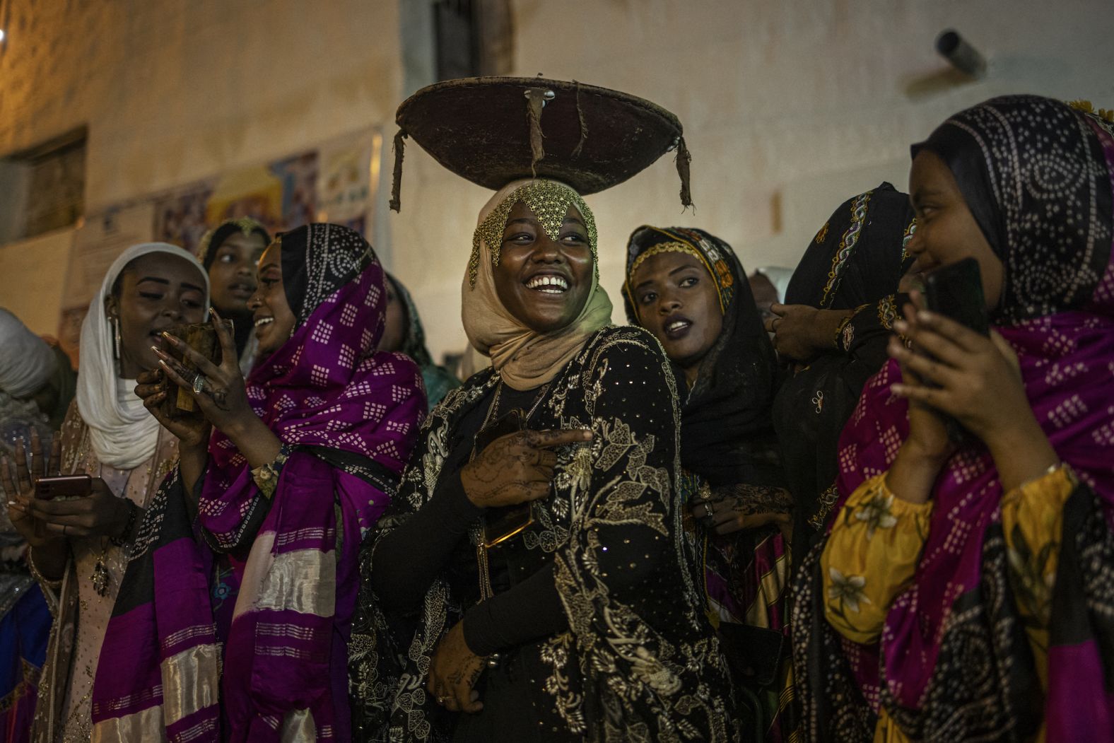 Young women dressed in traditional attire sing and dance during the Shuwalid festival in Harar, Ethiopia, on Tuesday, April 16. Shuwalid is an annual festival celebrated by the Harari people of Ethiopia and marks the end of six days of fasting to compensate omissions during Ramadan.
