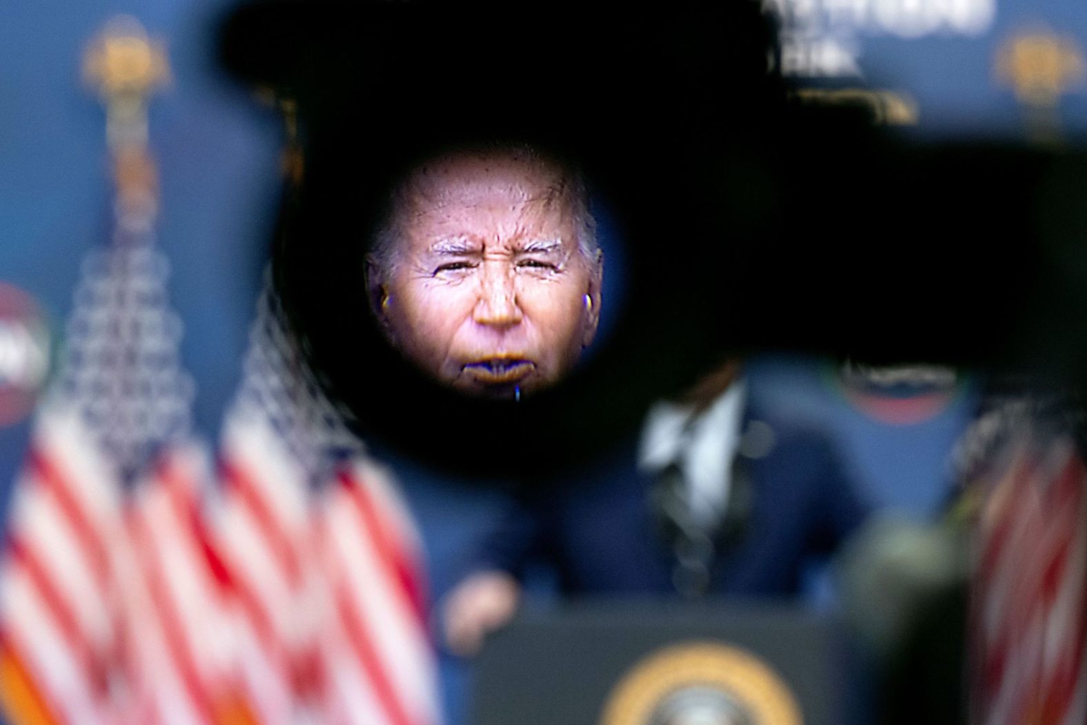 President Joe Biden is seen in the viewfinder of a video camera as he delivers virtual remarks during the National Action Network Convention in Washington, DC, on Friday, April 12.