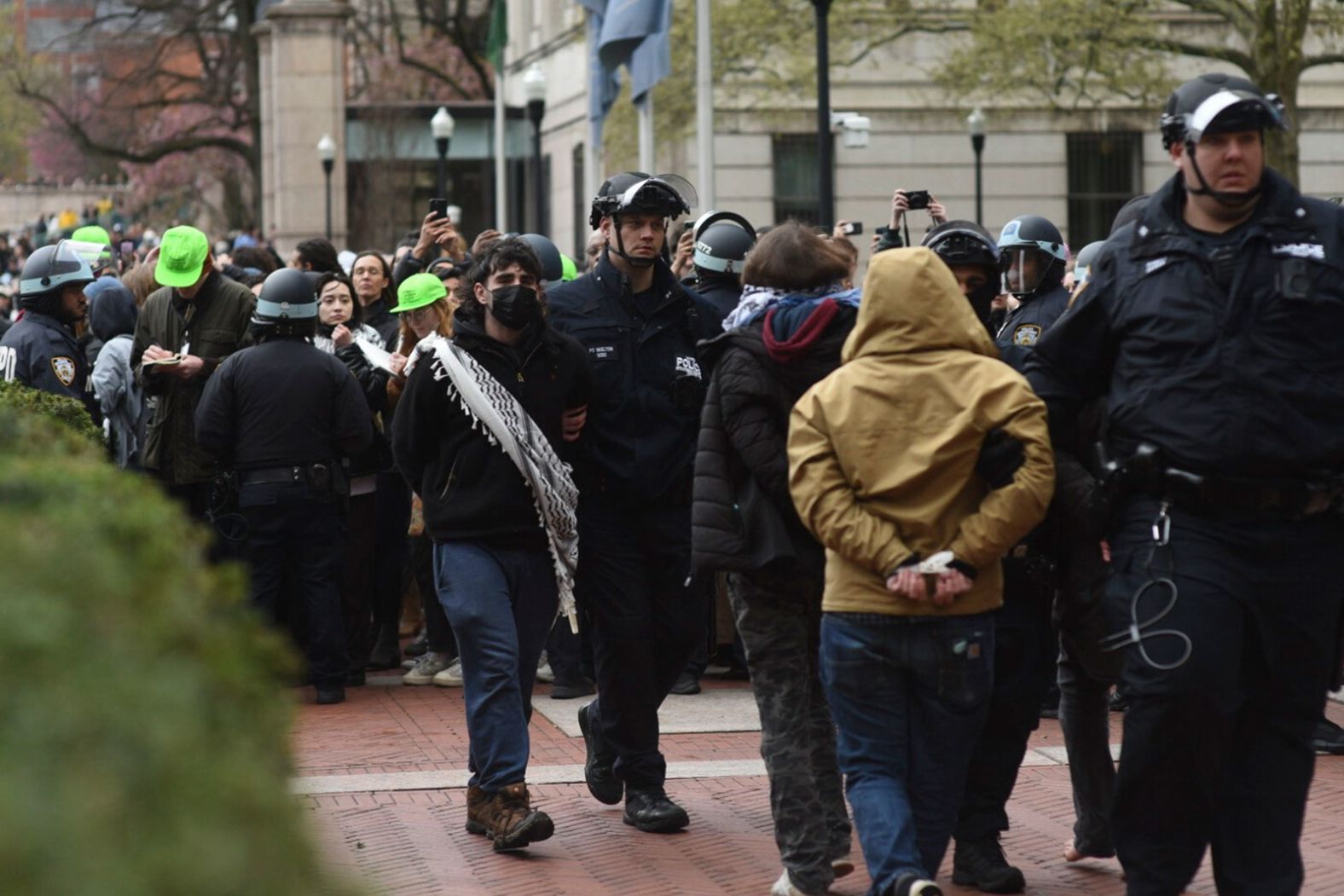 Police officers arrest pro-Palestinian demonstrators who had set up an encampment at Columbia University in New York on Thursday, April 18. <a href="https://www.cnn.com/2024/04/18/us/nypd-disperses-pro-palestinian-protest-columbia-university/index.html" target="_blank">More than 100 people were arrested</a> on suspicion of criminal trespass, according to a law enforcement official, as police dispersed the protest, which began a day earlier as the university's president <a href="https://www.cnn.com/business/live-news/columbia-antisemitism-house-testimony/index.html" target="_blank">testified before a House committee</a> about the school's response to antisemitism.