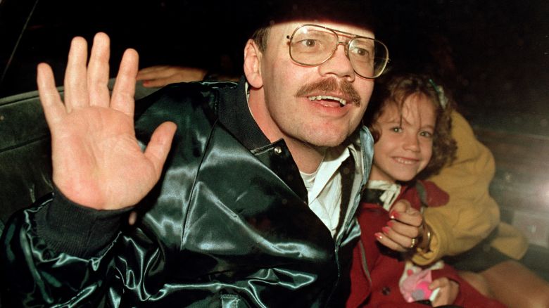 FILE - Terry Anderson, who was the longest held American hostage in Lebanon, grins with his 6-year-old daughter Sulome, Dec. 4, 1991, as they leave the U.S. Ambassador's residence in Damascus, Syria, following Anderson's release. Anderson, the globe-trotting Associated Press correspondent who became one of America's longest-held hostages after he was snatched from a street in war-torn Lebanon in 1985 and held for nearly seven years, died Sunday, April 21, 2024. He was 76. (AP Photo/Santiago Lyon, File)