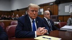 Former President Donald Trump looks on at Manhattan Criminal Court during his trial for allegedly covering up hush money payments linked to extramarital affairs in New York on April 22, 2024.
