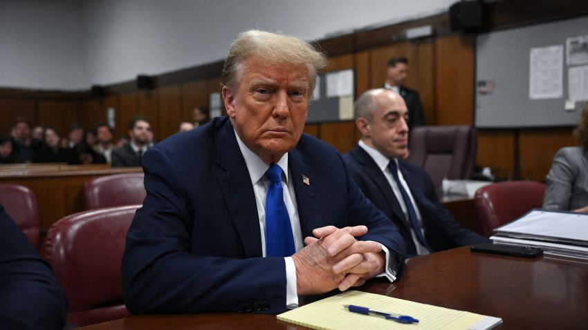 Former President Donald Trump looks on at Manhattan Criminal Court during his trial for allegedly covering up hush money payments linked to extramarital affairs in New York on April 22, 2024. 