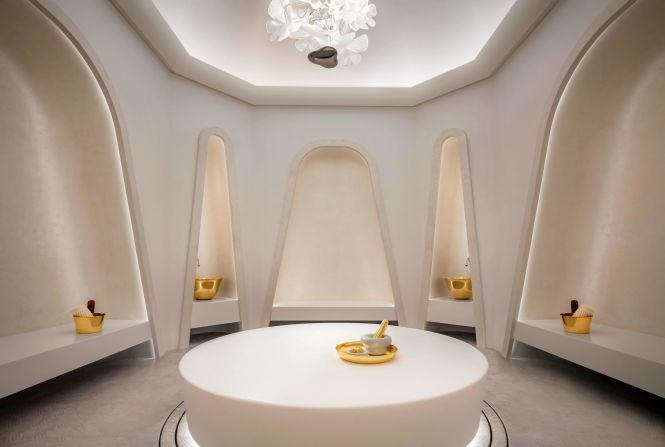 Like the resort's minimalist exteriors, the spa's modern hammam takes a pared-back approach to traditional Arabic design with abstract arches and gold accents.