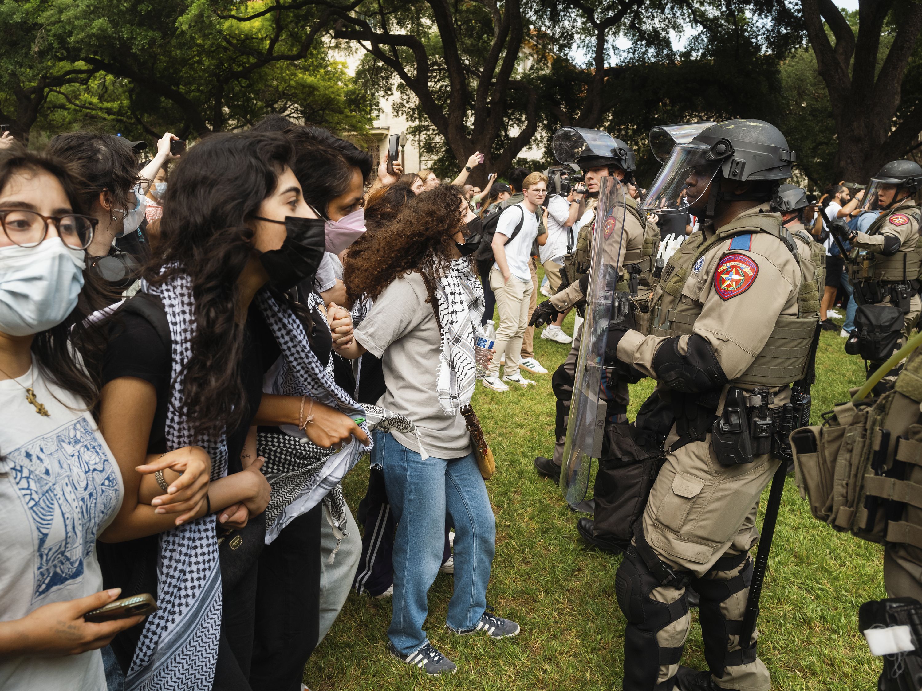 Demonstrators and Texas state troopers face one another in Austin on April 24.