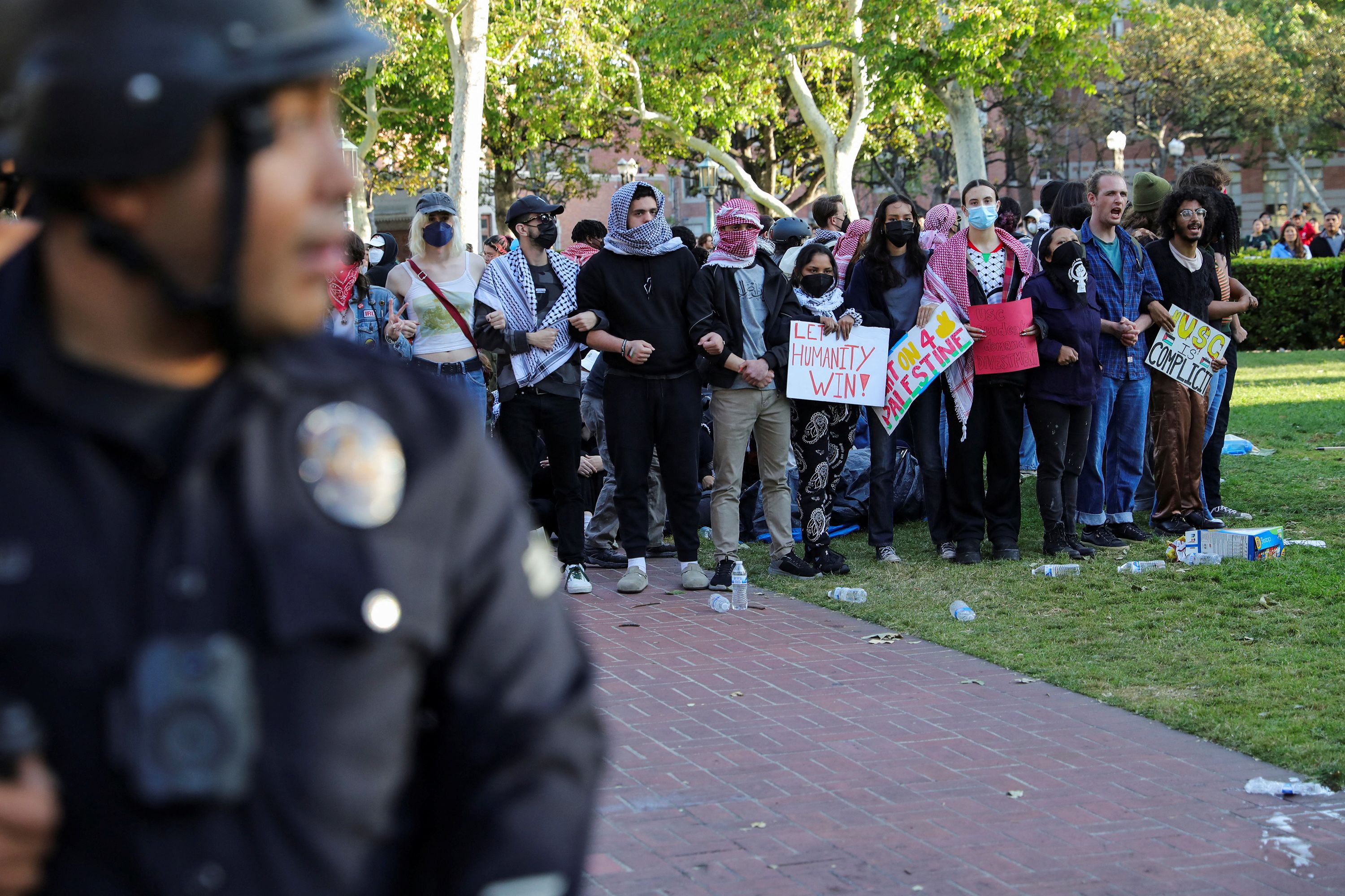 Police stand near protesters at the University of Southern California on April 24.