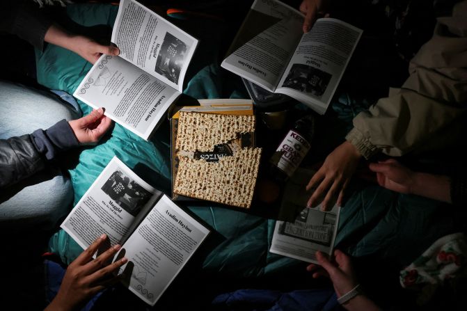 A group of Jewish and non-Jewish students gather at the Columbia encampment <a href="https://www.cnn.com/business/live-news/columbia-yale-student-protests-4-23-24/h_1035bd2d5f93432214fd7f1f507ee8c4" target="_blank">to celebrate Seder</a>, a ritual feast at the start of the Jewish holiday of Passover. Columbia student Cameron Jones told CNN: "I am Jewish and, to me, Passover symbolizes perseverance and resilience. I think this encampment represents those two ideals because we have seen the university take countless measures to try to suppress our student activism, and here is us persevering through that."
