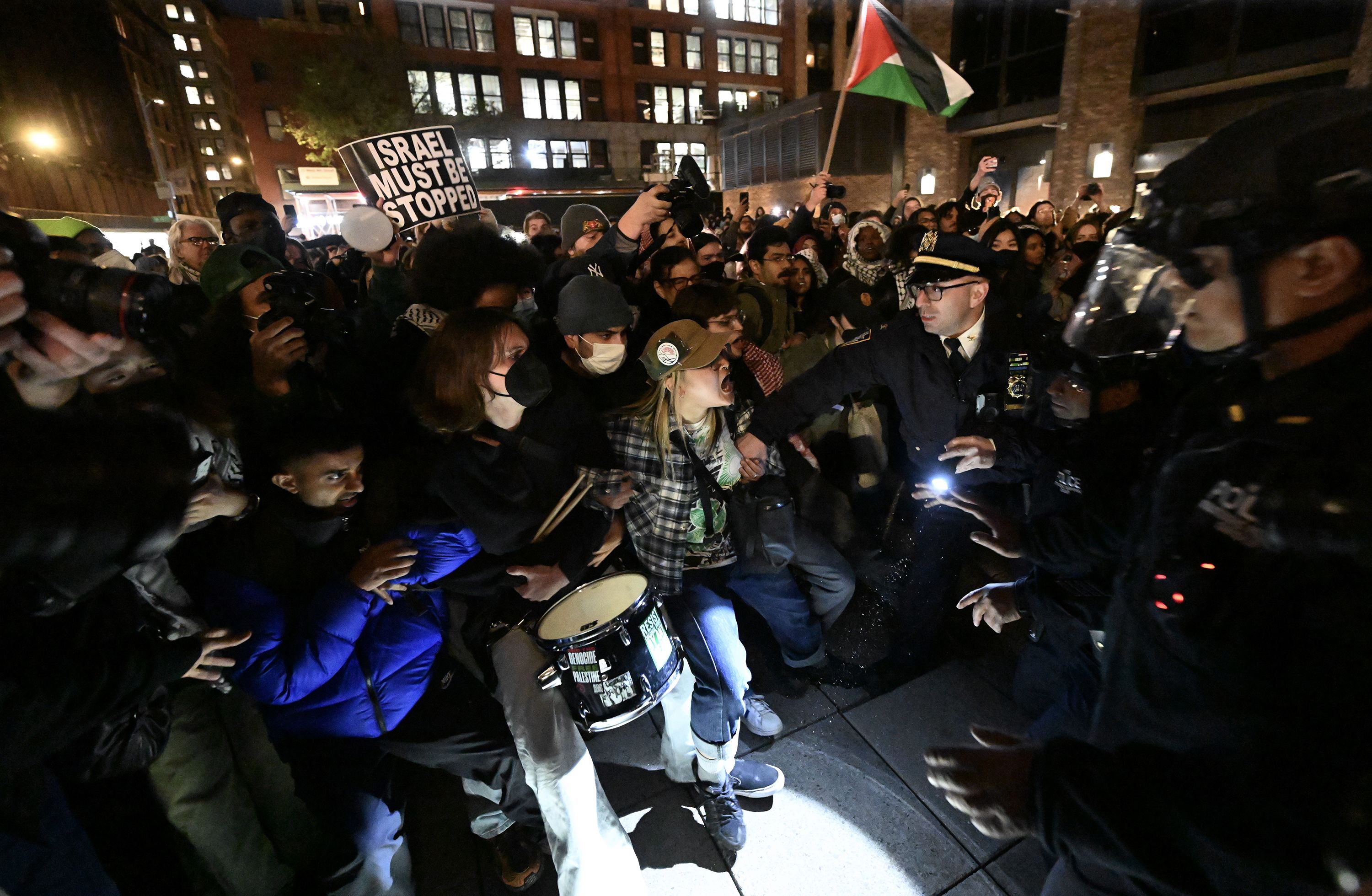 Police and protesters face off at New York University on Monday, April 22.