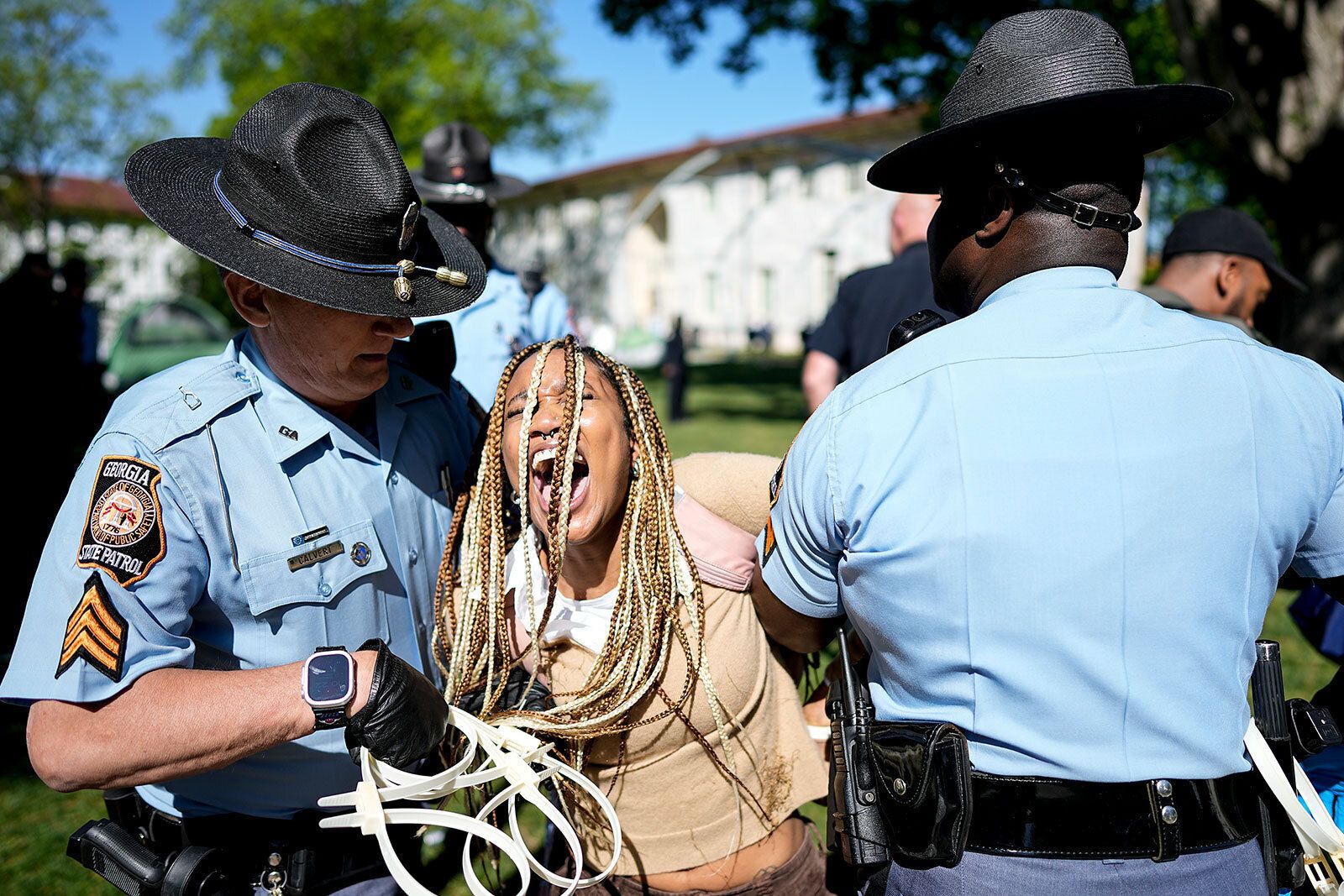 Georgia State Patrol officers detain a demonstrator on the campus of Emory University during a pro-Palestinian demonstration in Atlanta on Thursday, April 25.