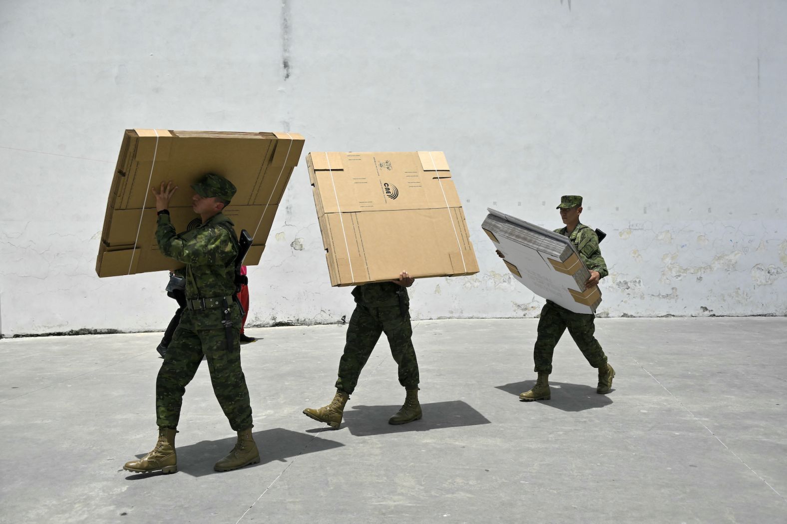 Soldiers carry electoral material at a school in Quito, Ecuador, on Saturday, April 20. <a href="https://www.cnn.com/2024/04/22/americas/ecuador-referendum-results-intl-latam/index.html" target="_blank">Early results from Ecuador's referendum Sunday</a> suggest President Daniel Noboa has won public backing for security measures aimed at boosting his war on crime.