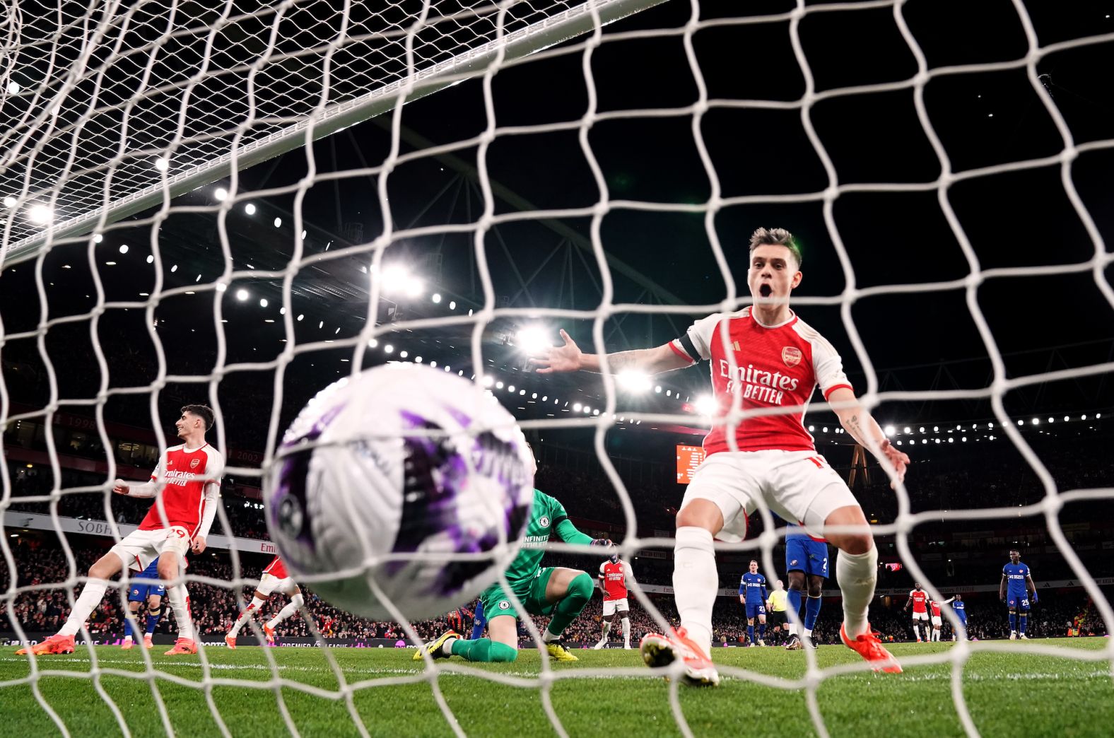 Arsenal's Leandro Trossard reacts after teammate Ben White scored the London side's fifth goal of the game during a 5-0 Premier League victory against Chelsea on Tuesday, April 23.
