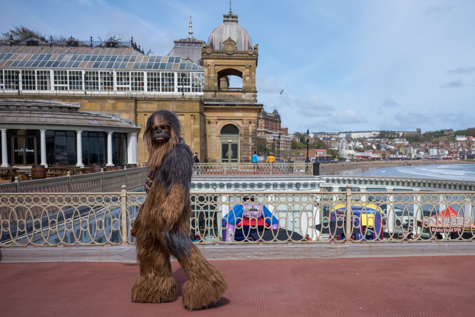 A man dressed as "Star Wars" character Chewbacca walks near the Scarborough Spa in Scarborough, England, on Sunday, April 21. The seaside town was hosting a sci-fi convention.