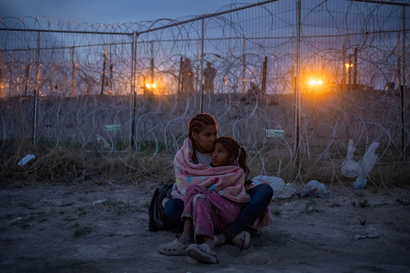 Michel, a Venezuelan migrant, holds her 7-year-old daughter Aranza at the US-Mexico border near El Paso, Texas, on Wednesday, April 24.