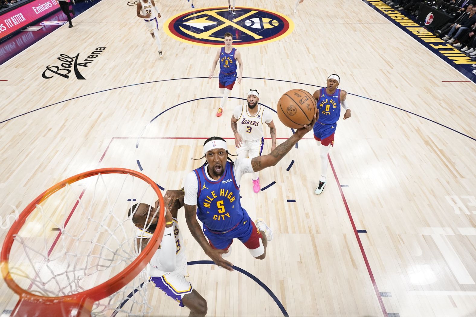 Denver Nuggets guard Kentavious Caldwell-Pope rises for a shot as he is defended by the Los Angeles Lakers' LeBron James during an NBA playoff game on Saturday, April 20. The defending champion Nuggets won the opening game of the series.