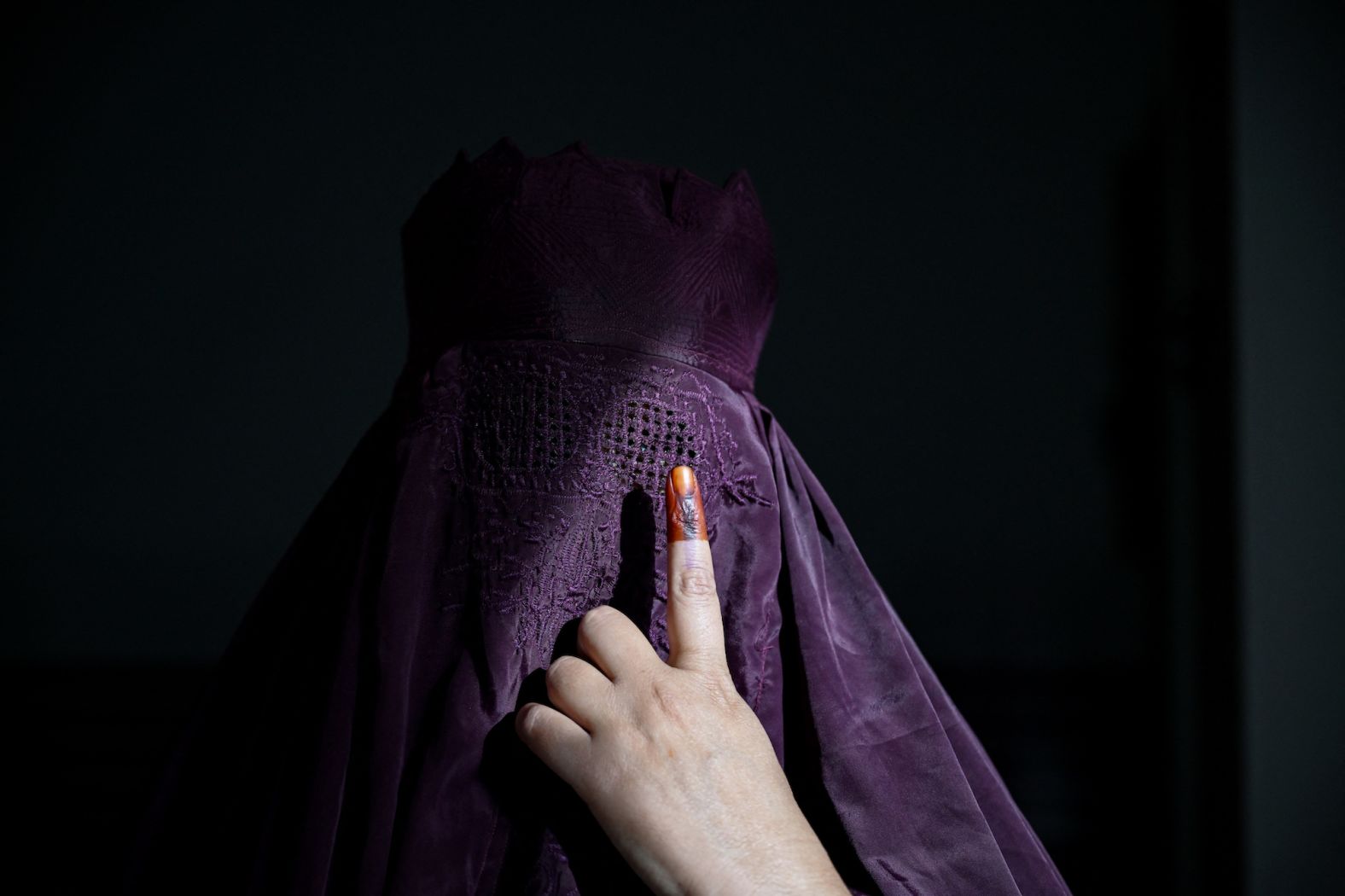 A burqa-clad woman shows her inked finger after she cast a ballot in Kairana, India, on Friday, April 19. A mammoth exercise in democracy is underway in India, where nearly a billion people will go to the polls over the next six weeks to vote in <a href="https://www.cnn.com/2024/04/17/india/india-election-2024-hnk-intl-dg/index.html" target="_blank">the world's largest-ever general election</a>.