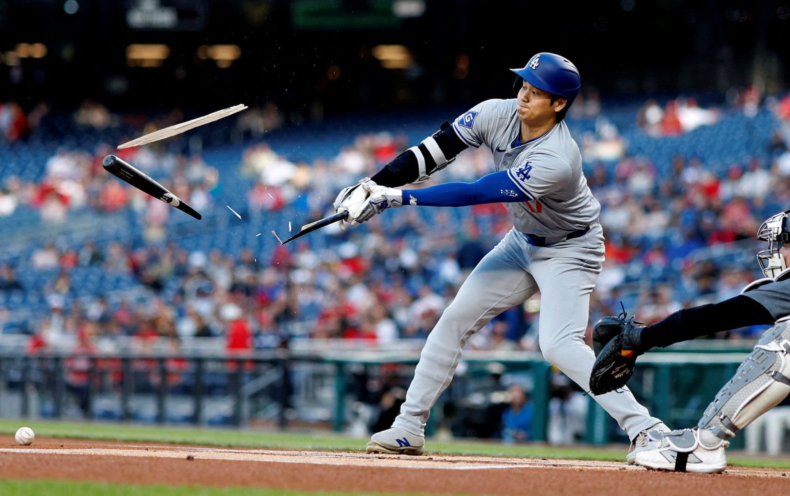 The bat of Los Angeles Dodgers star Shohei Ohtani shatters during a Major League Baseball game in Washington, DC, on Tuesday, April 23.