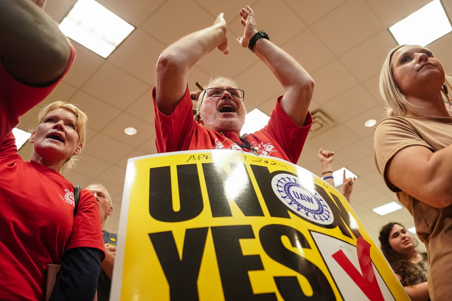 People celebrate at a United Auto Workers vote watch party in Chattanooga, Tennessee, on Friday, April 19. Hourly workers at Volkswagen's plant in Chattanooga <a href="index.php?page=&url=https%3A%2F%2Fwww.cnn.com%2F2024%2F04%2F19%2Fbusiness%2Fvolkswagen-uaw-vote%2Findex.html" target="_blank">overwhelmingly voted to join the UAW</a>, a major breakthrough in the union's effort to organize workers at plants nationwide.