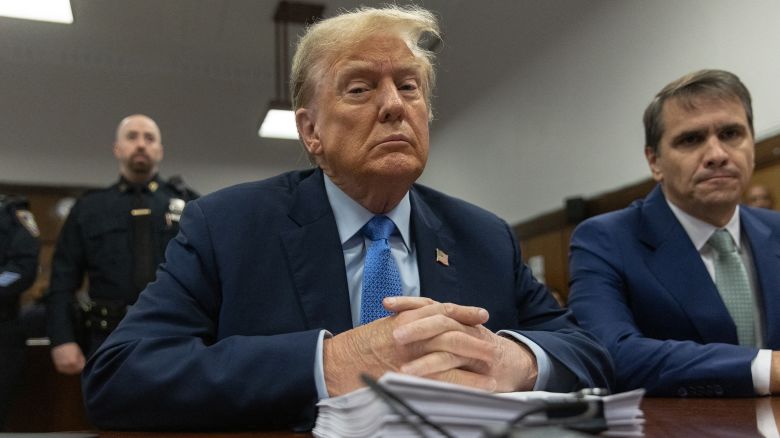 Former President Donald Trump, sitting with attorney Todd Blanche, right, attends his trial for allegedly covering up hush money payments at Manhattan Criminal Court in New York City on April 26.