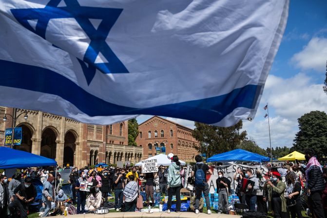 Jewish students wave Israeli flags as a counter-protest near a pro-Palestinian camp at UCLA on April 25.