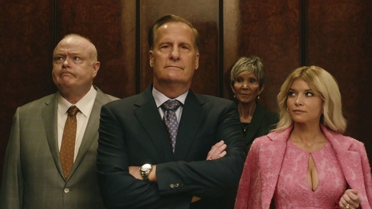 (L-R) Christian Clemenson, Jeff Daniels, an unidentified woman, and Sarah Jones stand in an elevator in 'A Man in Full'