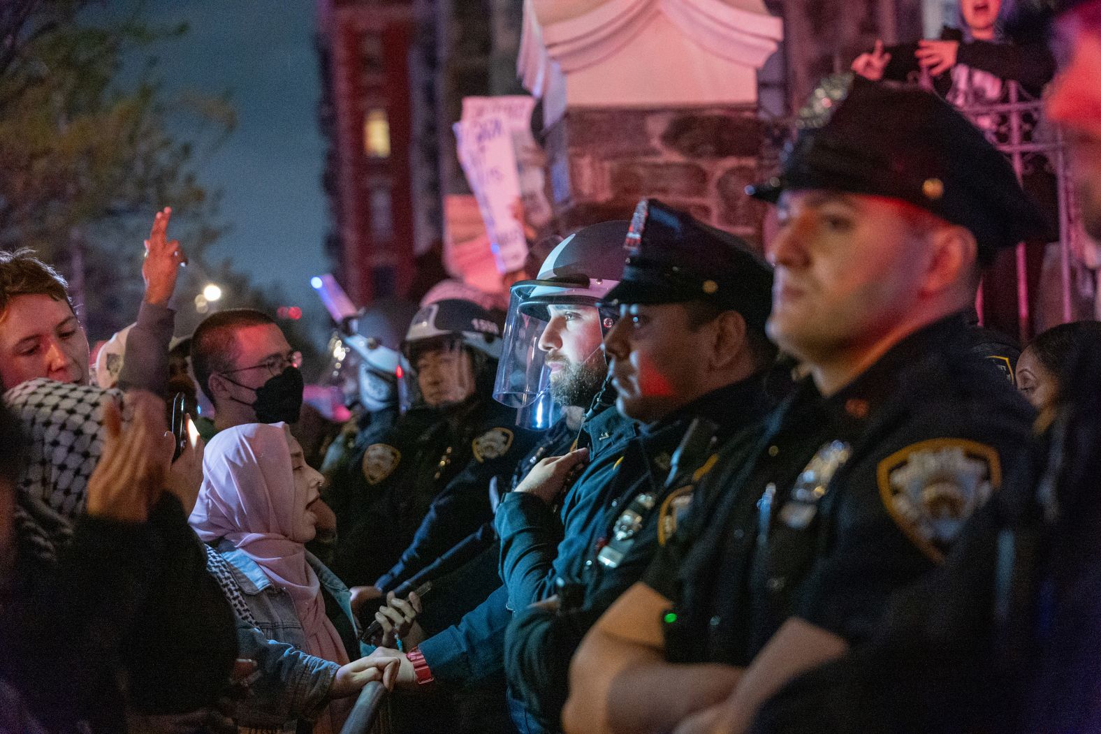 Protesters confront police at The City College of New York on April 30.