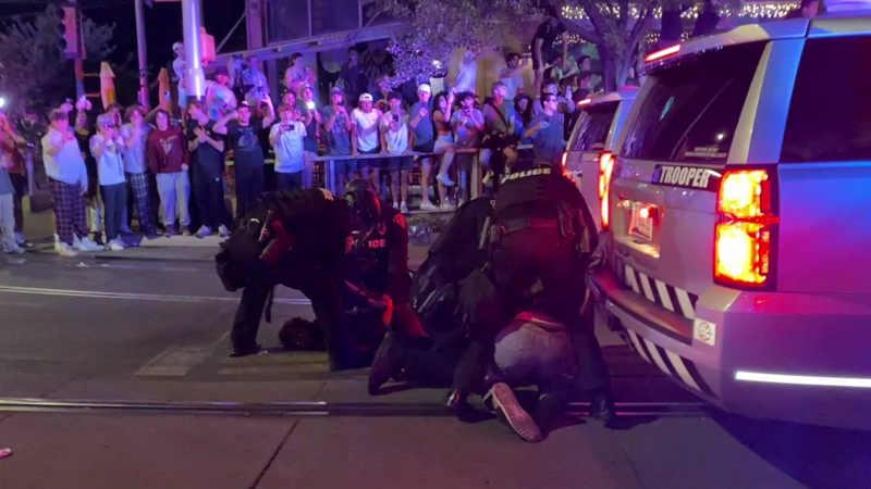 Armed police confront and arrest University of Arizona protesters