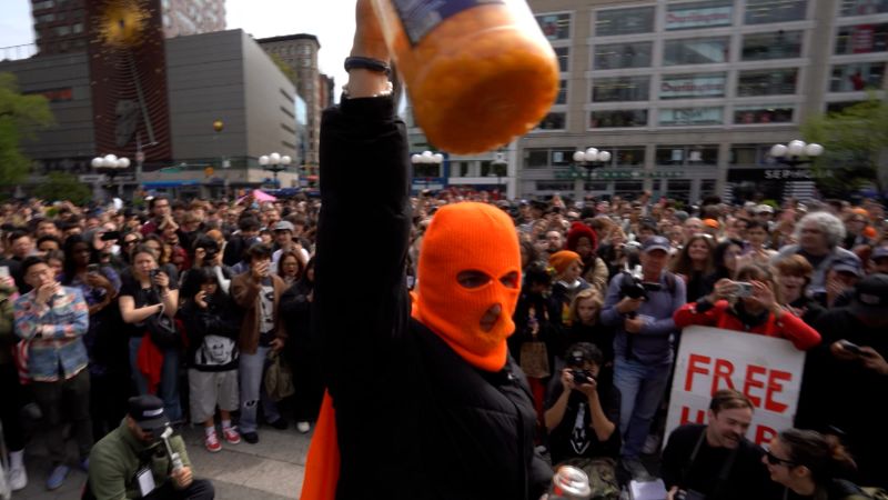 Masked man goes viral for eating hundreds of cheeseballs | CNN
