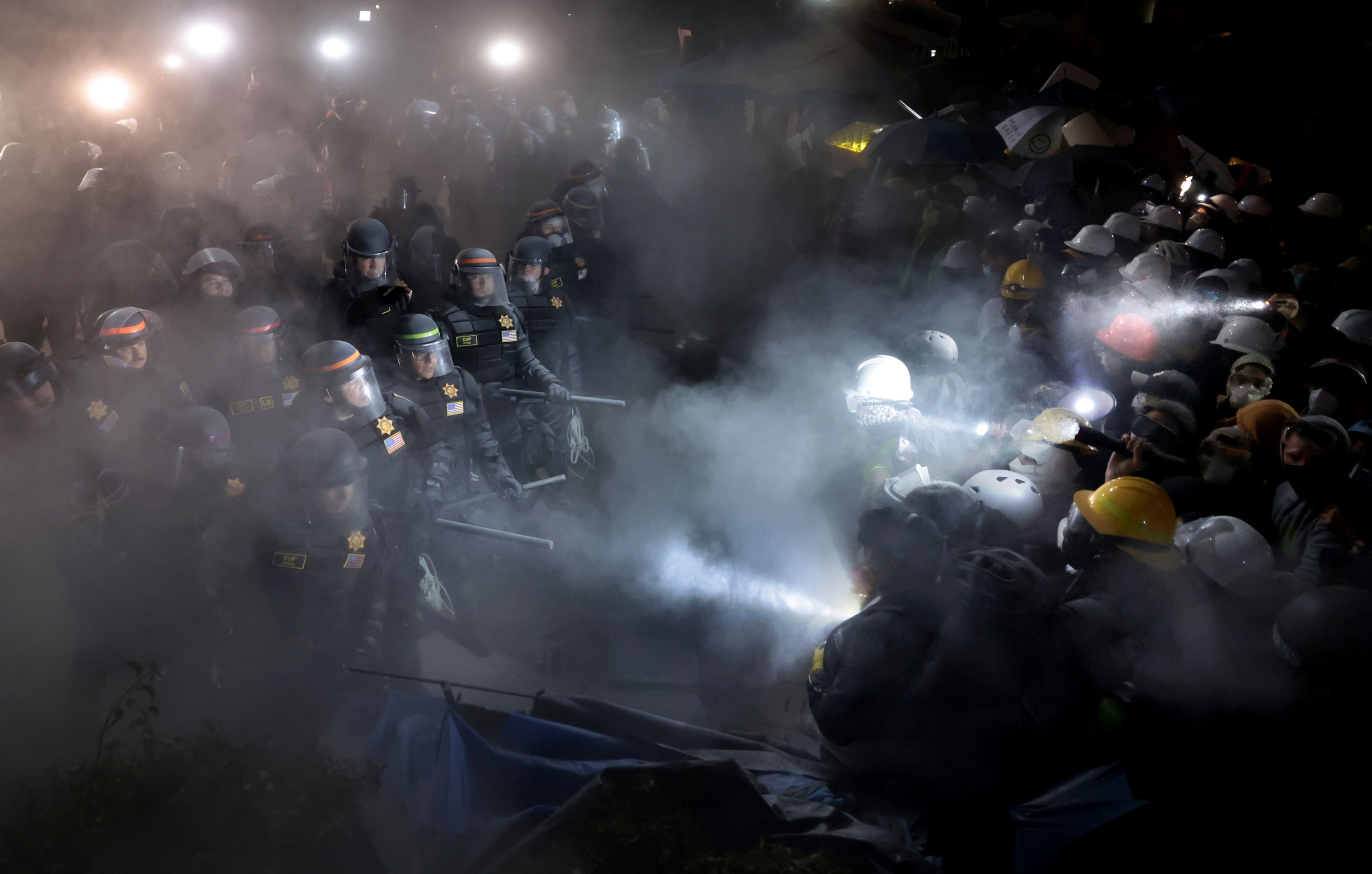 A fire extinguisher is deployed as police officers clash with pro-Palestinian protesters at the University of California, Los Angeles, early on Thursday, May 2.