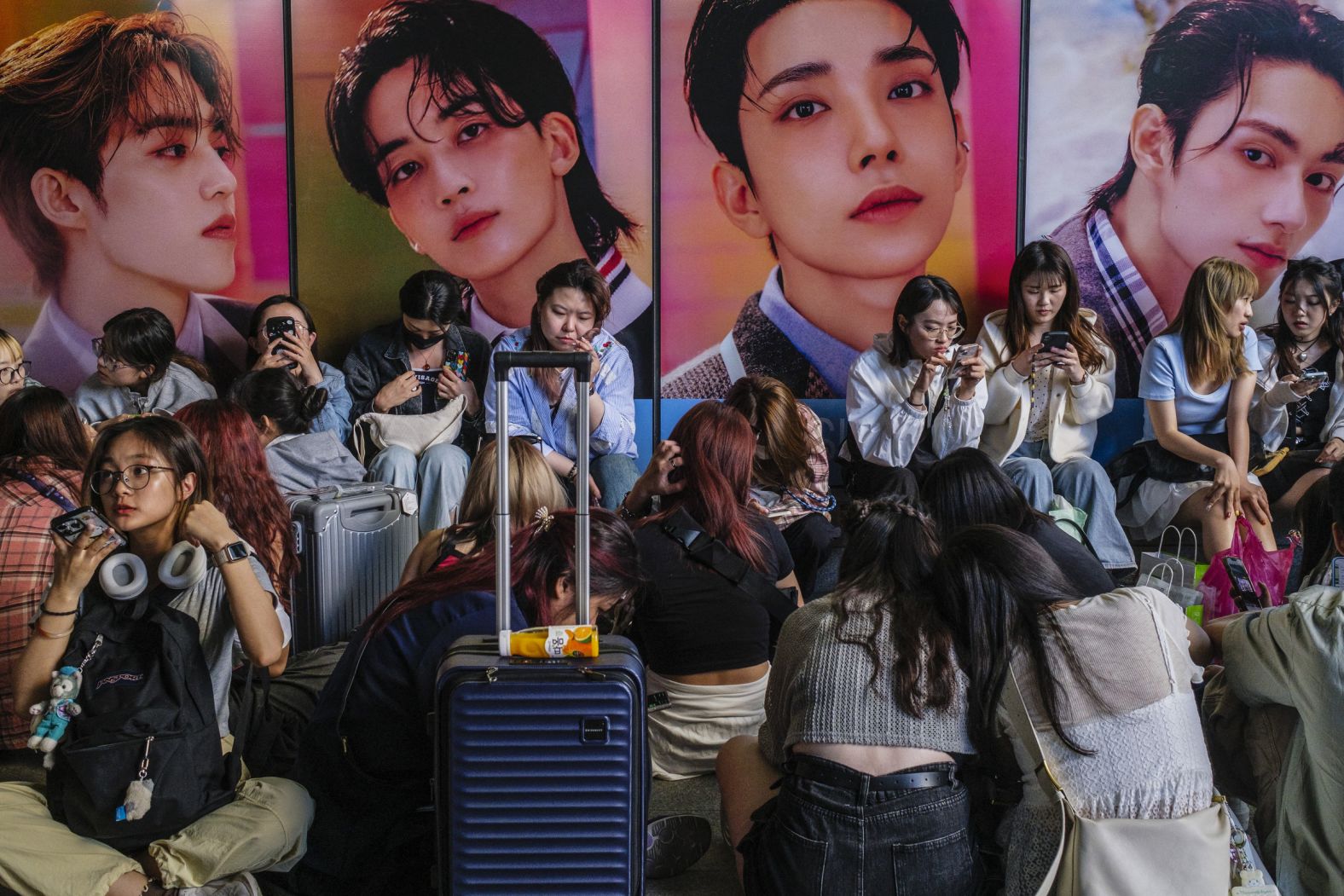 Fans line up to buy the new album "17 is Right Here" by South Korean boy band Seventeen outside a convenience store in Seoul, South Korea, on Monday, April 29.