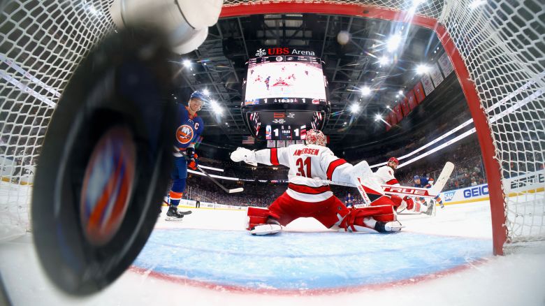 ELMONT, NEW YORK - APRIL 27: Jean-Gabriel Pageau #44 of the New York Islanders (R) scores at 1:38 of the third period against Frederik Andersen #31 of the Carolina Hurricanes in Game Four of the First Round of the 2024 Stanley Cup Playoffs at UBS Arena on April 27, 2024 in Elmont, New York. The Islanders defeated the Hurricanes 3-2 in double overtime. (Photo by Bruce Bennett/Getty Images)