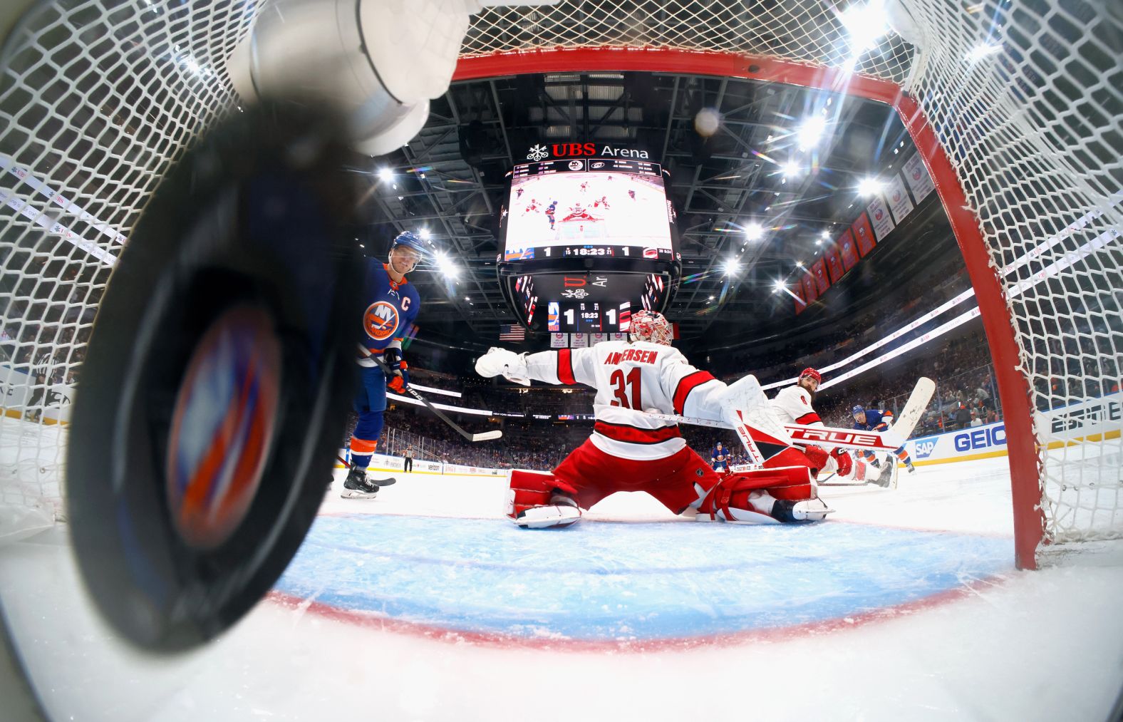 The puck gets by Carolina goaltender Frederik Andersen during the third period of NHL playoff game against the New York Islanders on Saturday, April 27. The Islanders went on to win this game in double overtime, but it was their only win of the series as Carolina advanced to the second round.