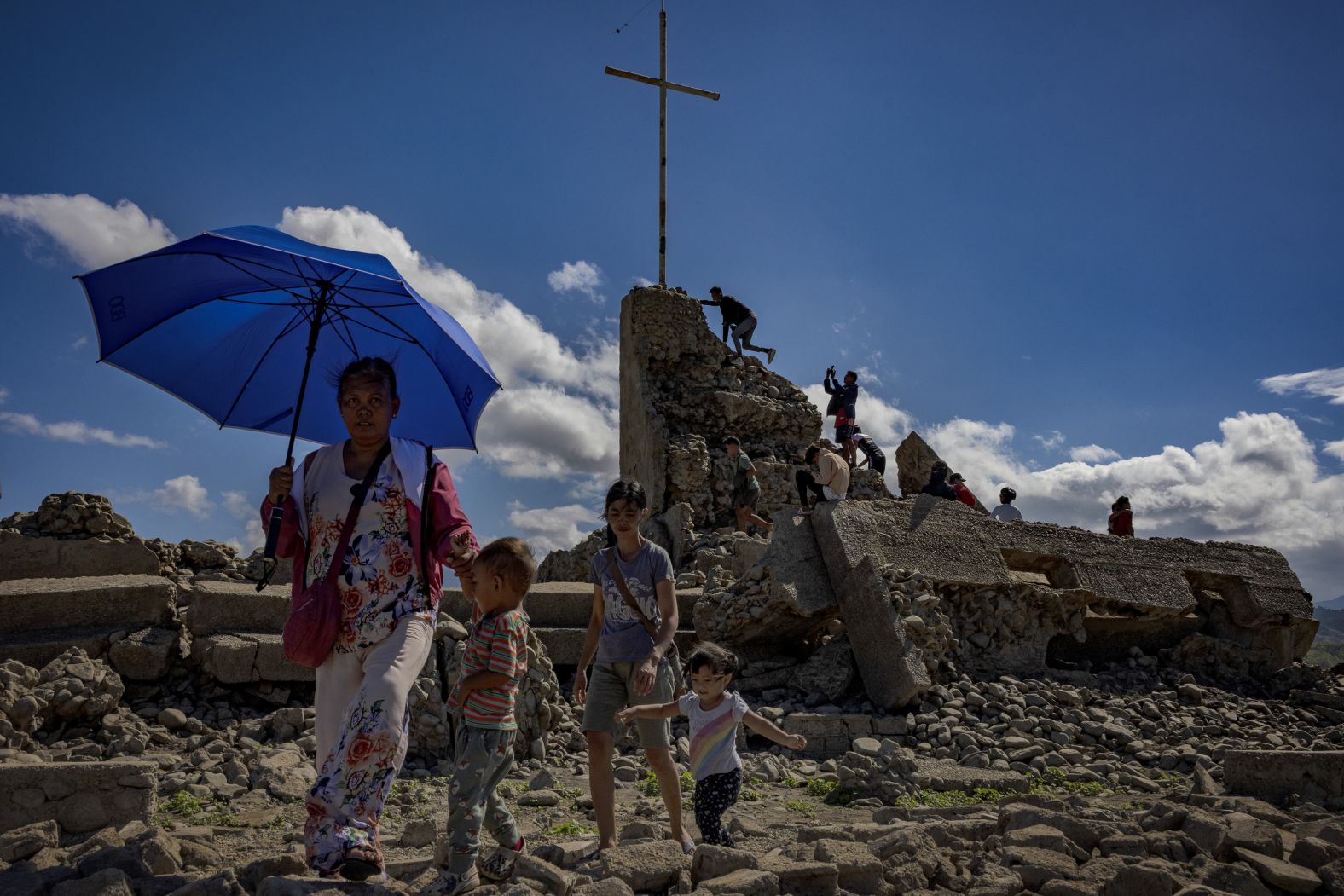 People visit the remnants of the old sunken town of Pantabangan, Philippines, on Sunday, April 28. The nearly 300-year-old settlement, once submerged beneath a major dam, <a href="index.php?page=&url=https%3A%2F%2Fwww.cnn.com%2F2024%2F04%2F30%2Fclimate%2Fsettlement-resurfaces-philippines-climate-dam-scli-intl%2Findex.html" target="_blank">has reemerged</a> as sweltering heat and drought dry up the reservoir.