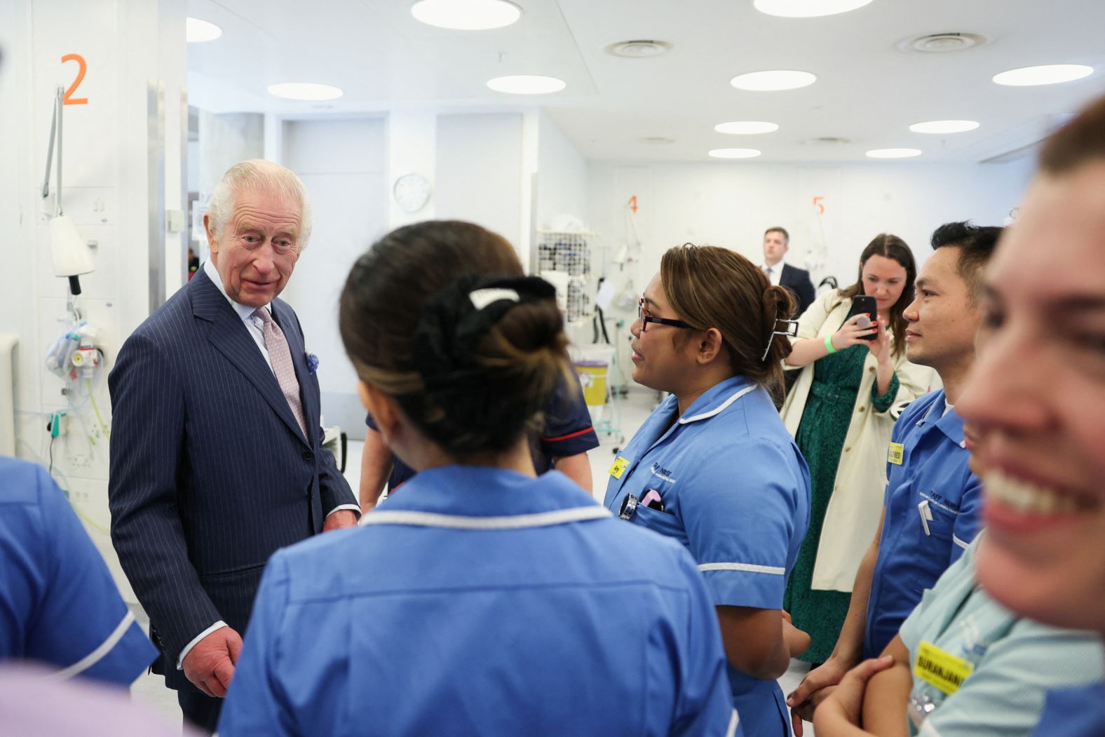 Britain's King Charles III meets with staff members at the University College Hospital Macmillan Cancer Centre in London on Tuesday, April 30. It was <a href="index.php?page=&url=https%3A%2F%2Fwww.cnn.com%2F2024%2F04%2F30%2Fuk%2Fking-charles-cancer-center-intl-gbr-scli%2Findex.html" target="_blank">the King's first official engagement</a> since he revealed that he was battling cancer in early February. 