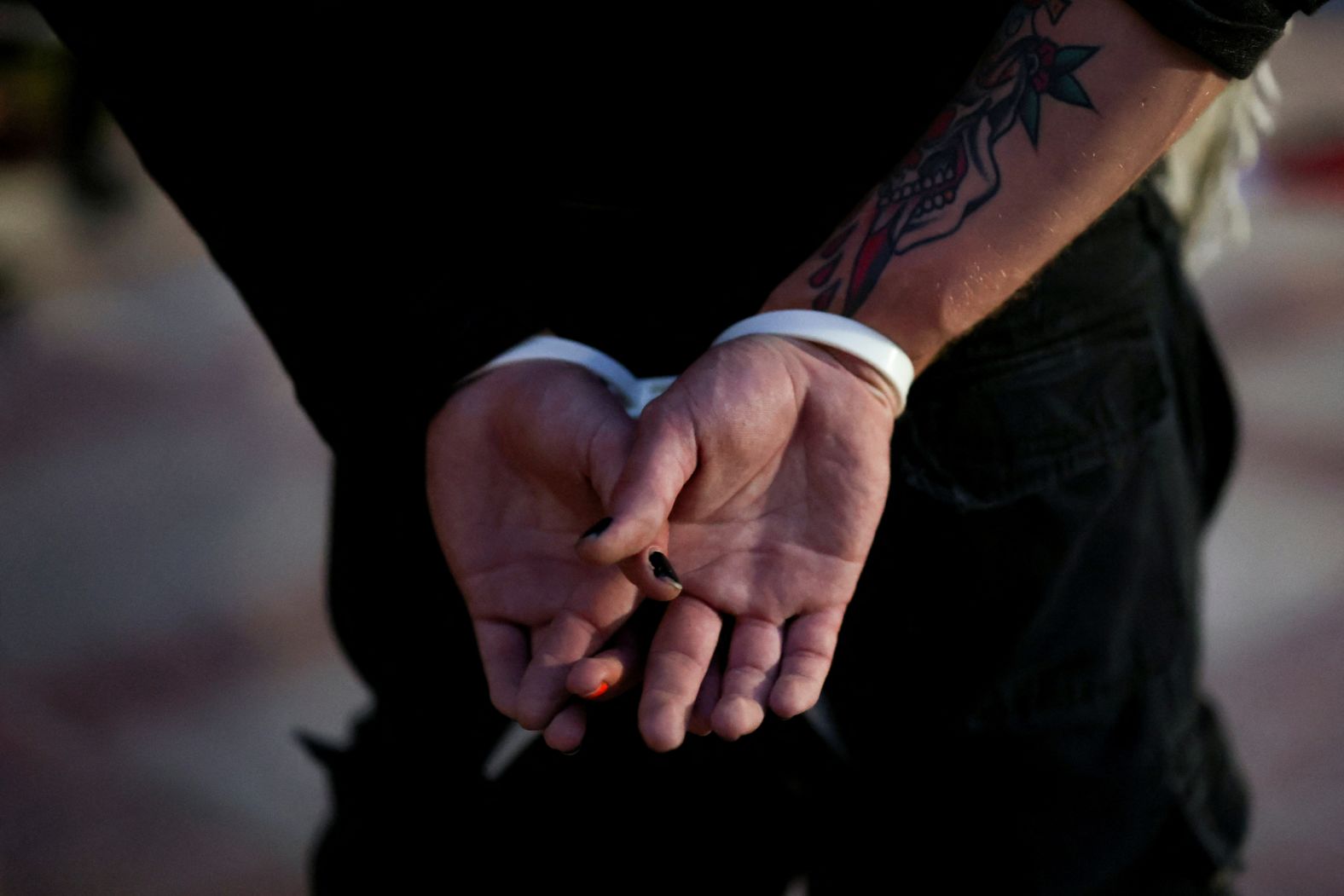 A protester is detained at the University of California, Los Angeles, on May 2.