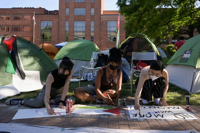 Activists make protest signs inside a pro-Palestinian encampment at George Washington University on May 2.