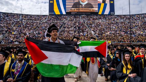ANN ARBOR, MICHIGAN - MAY 4: Students protest in support of Palestine during the University of Michigan's Spring Commencement ceremony on May 4, 2024 at Michigan Stadium in Ann Arbor, Michigan. A group of students called for the University of Michigan to divest from companies with ties to Israel during the spring commencement ceremony.  
 (Photo by Nic Antaya/Getty Images)
